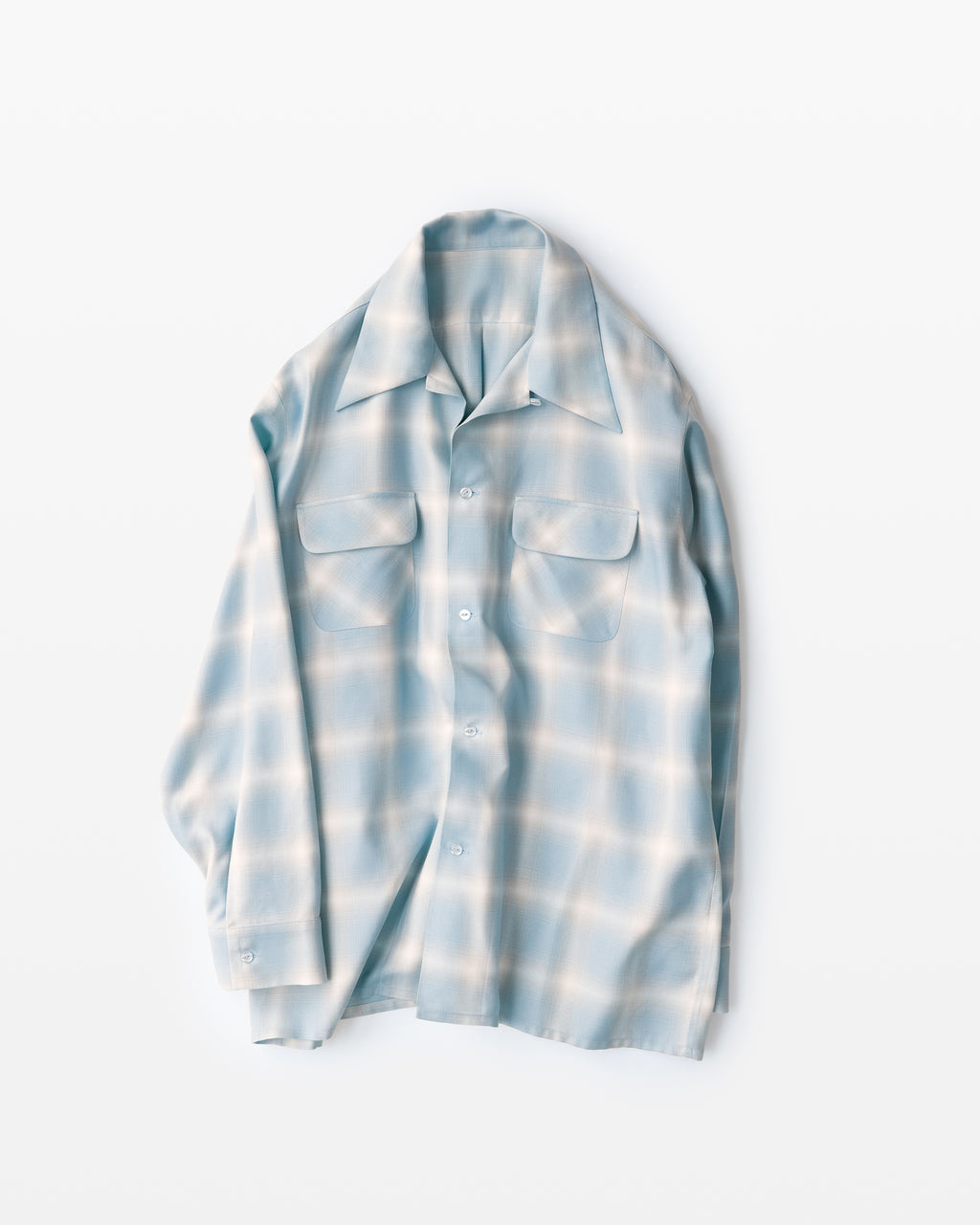 Light blue plaid shirt on a white background